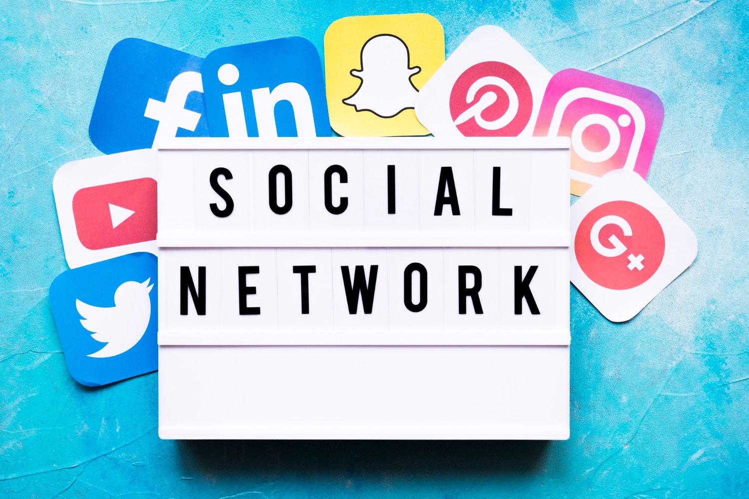 social network text with social media application icons painted on wall digital marketing concept