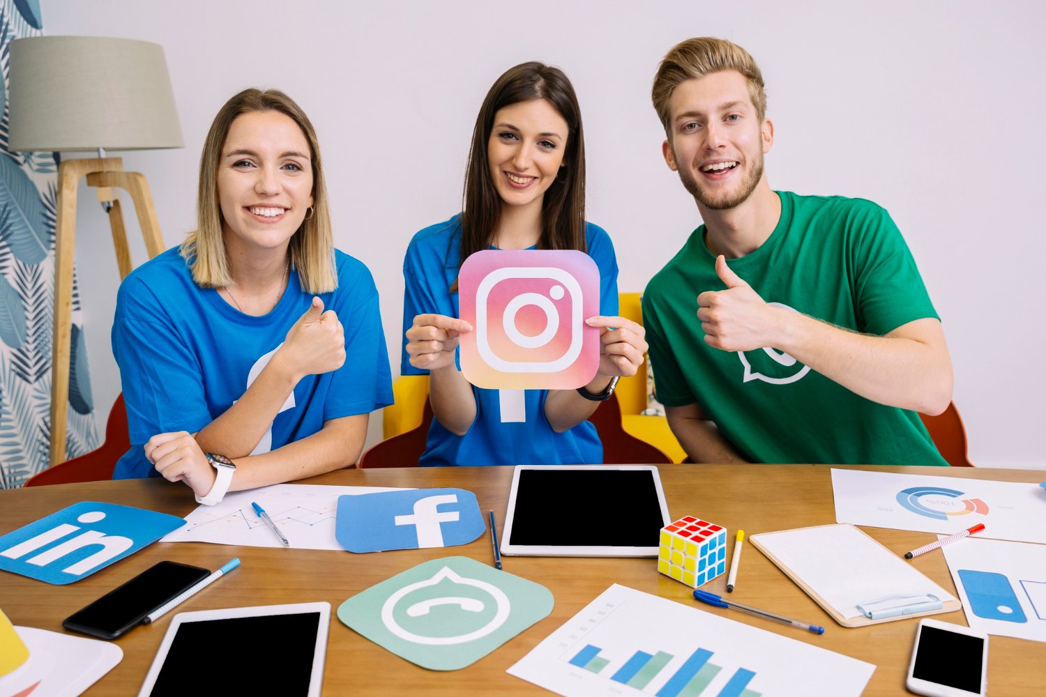 happy woman holding social media like symbol with friends thumbs up marketing concept