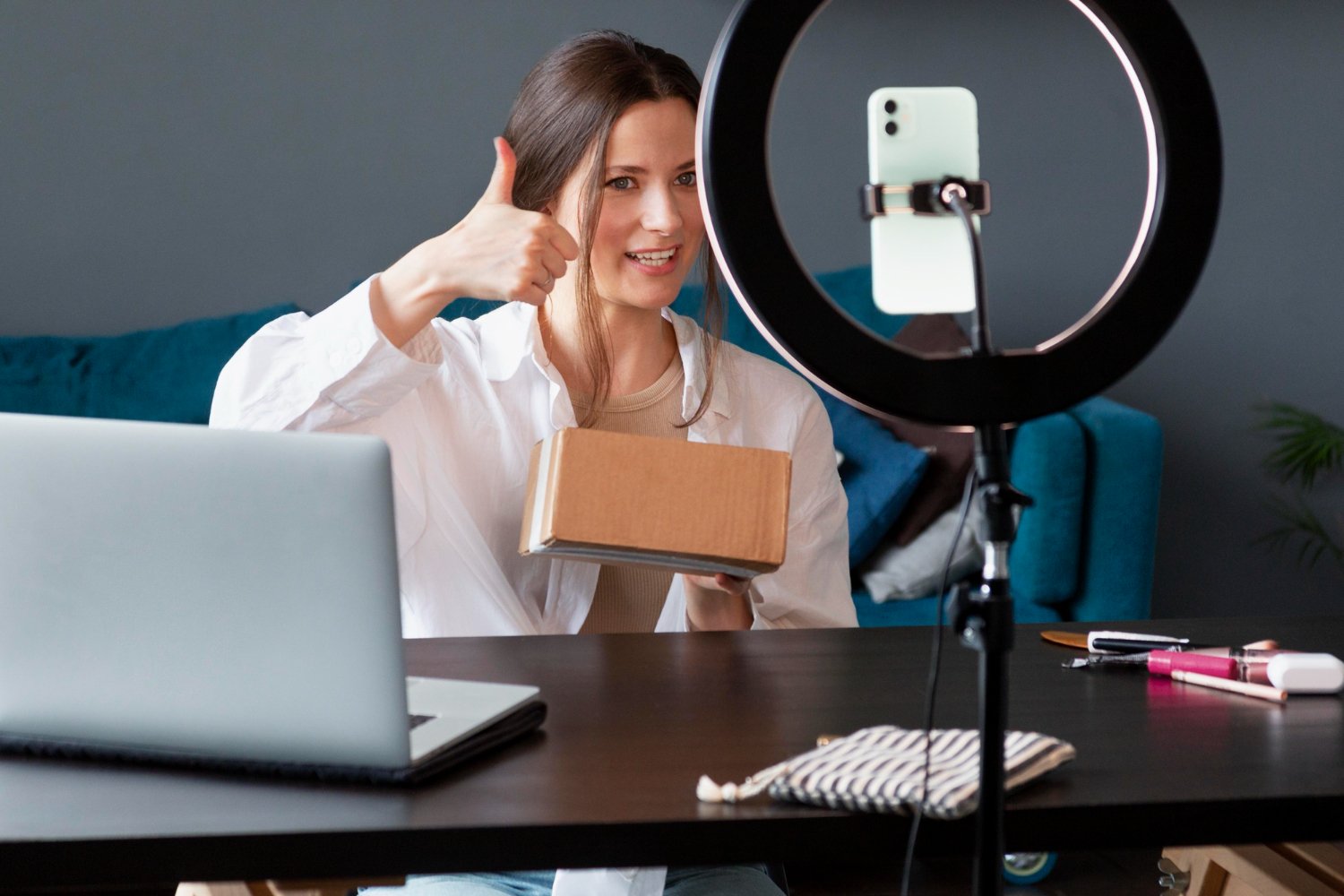 Influencer recording unboxing video for TikTok marketing and social media promotion.
