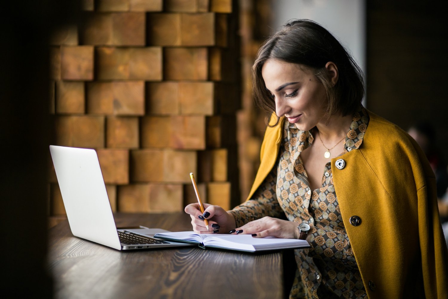 business woman working on laptop creating digital content and copywriting